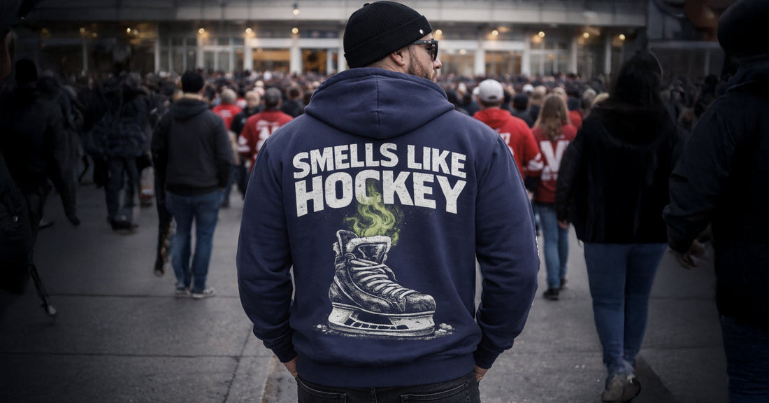 Navy blue hockey fan hoodie featuring 'Smells Like Hockey' text and skate graphic, funny hockey apparel for players and fans.